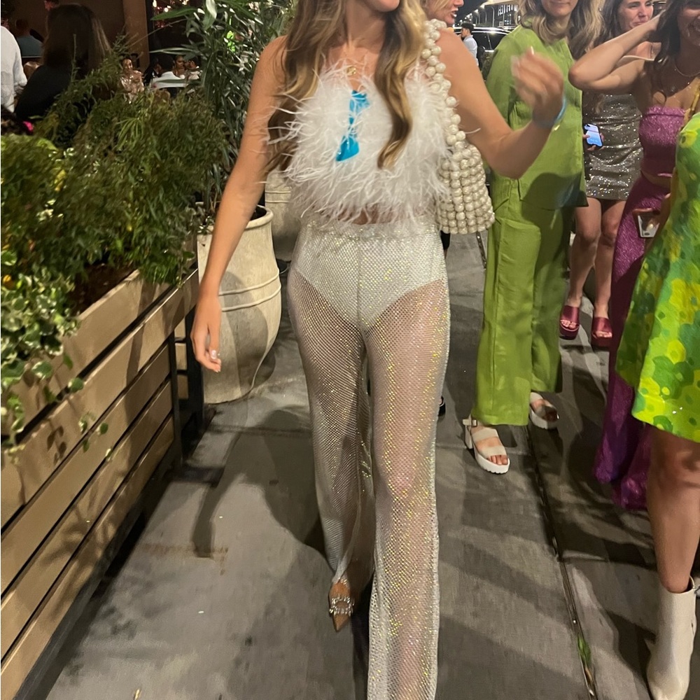 Feather top and sequin pants! So fun for bachelorette or wedding second look.